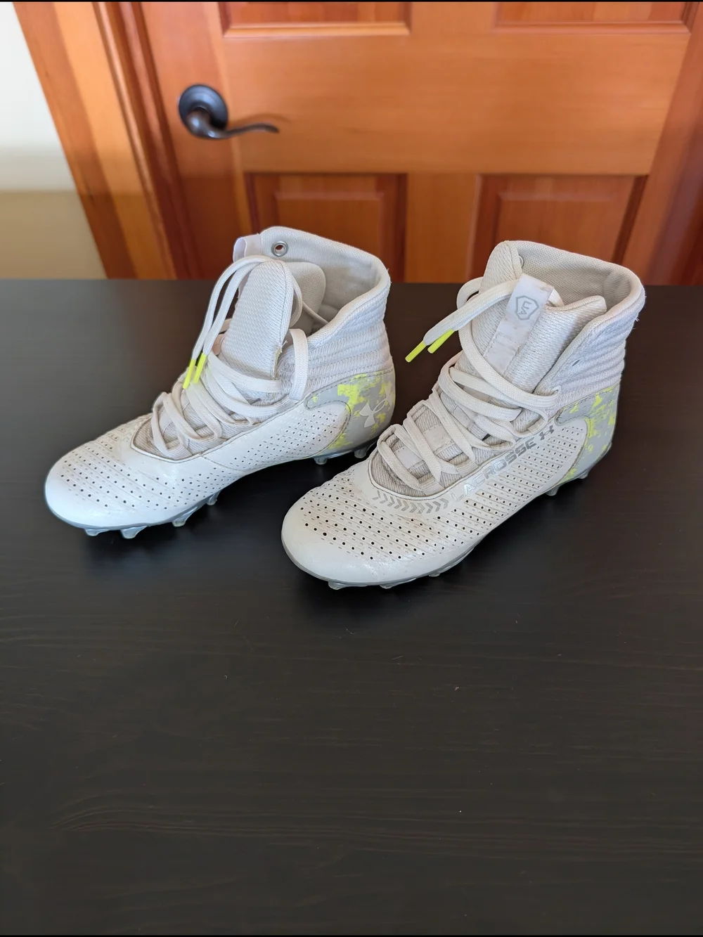 Under Armour Kids White High-Top Cleats with Neon Yellow Accent